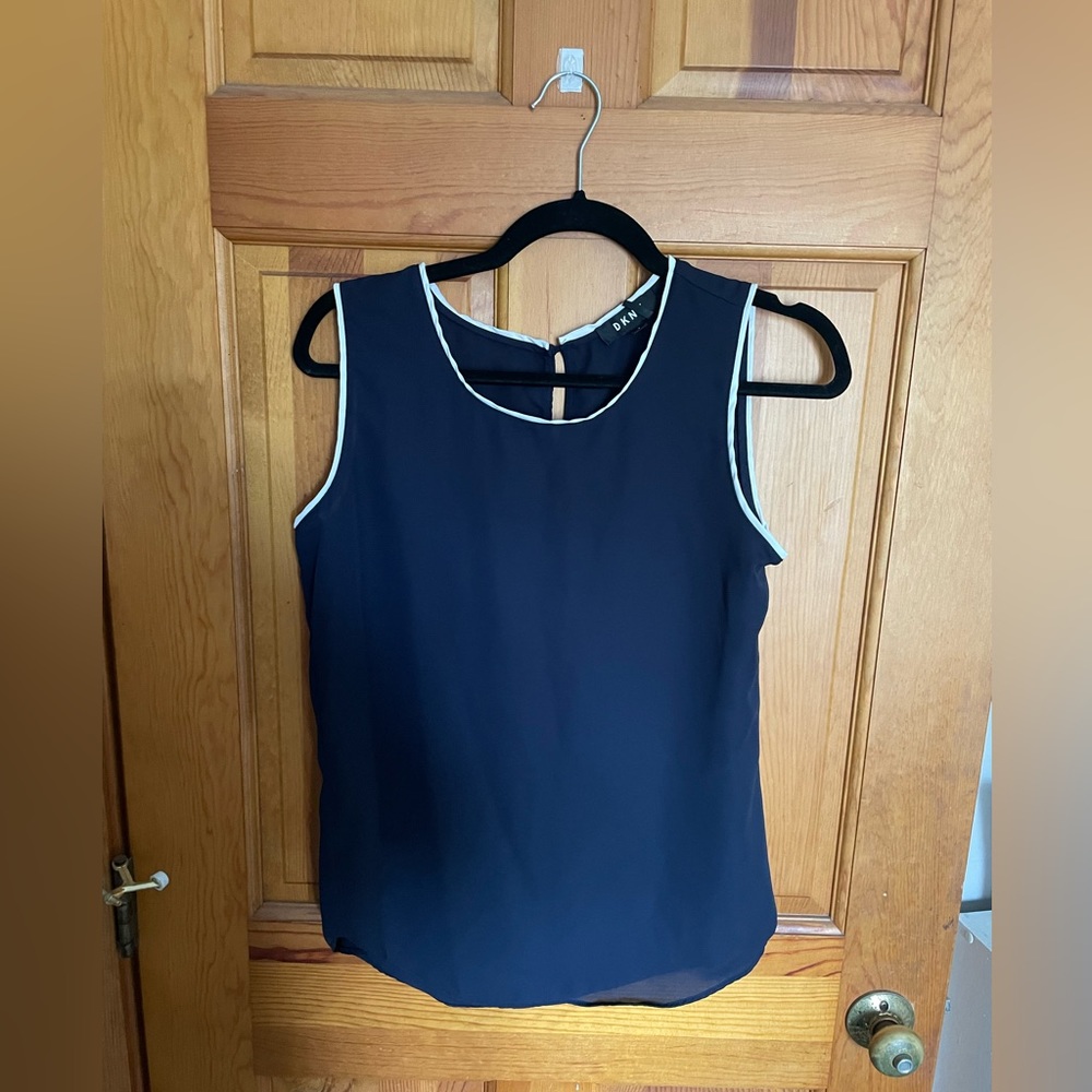 Size small light cut off blouse, brand DKN